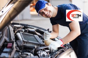 Mechanic working on a car engine